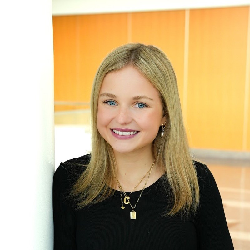 Ashlyn Long smiling at the Fairway Home Mortgage office
